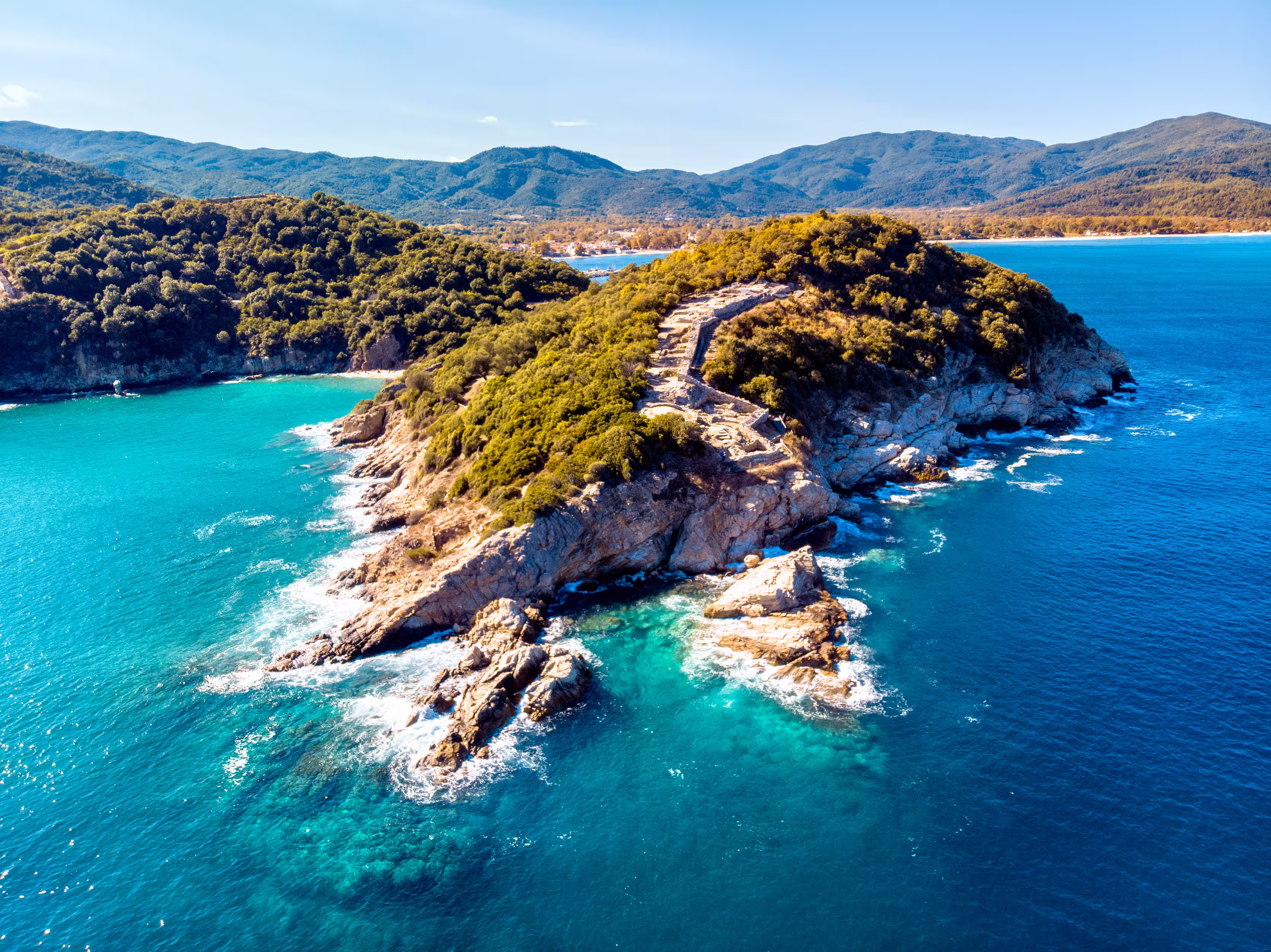 Aerial view of sea and rocky coastline