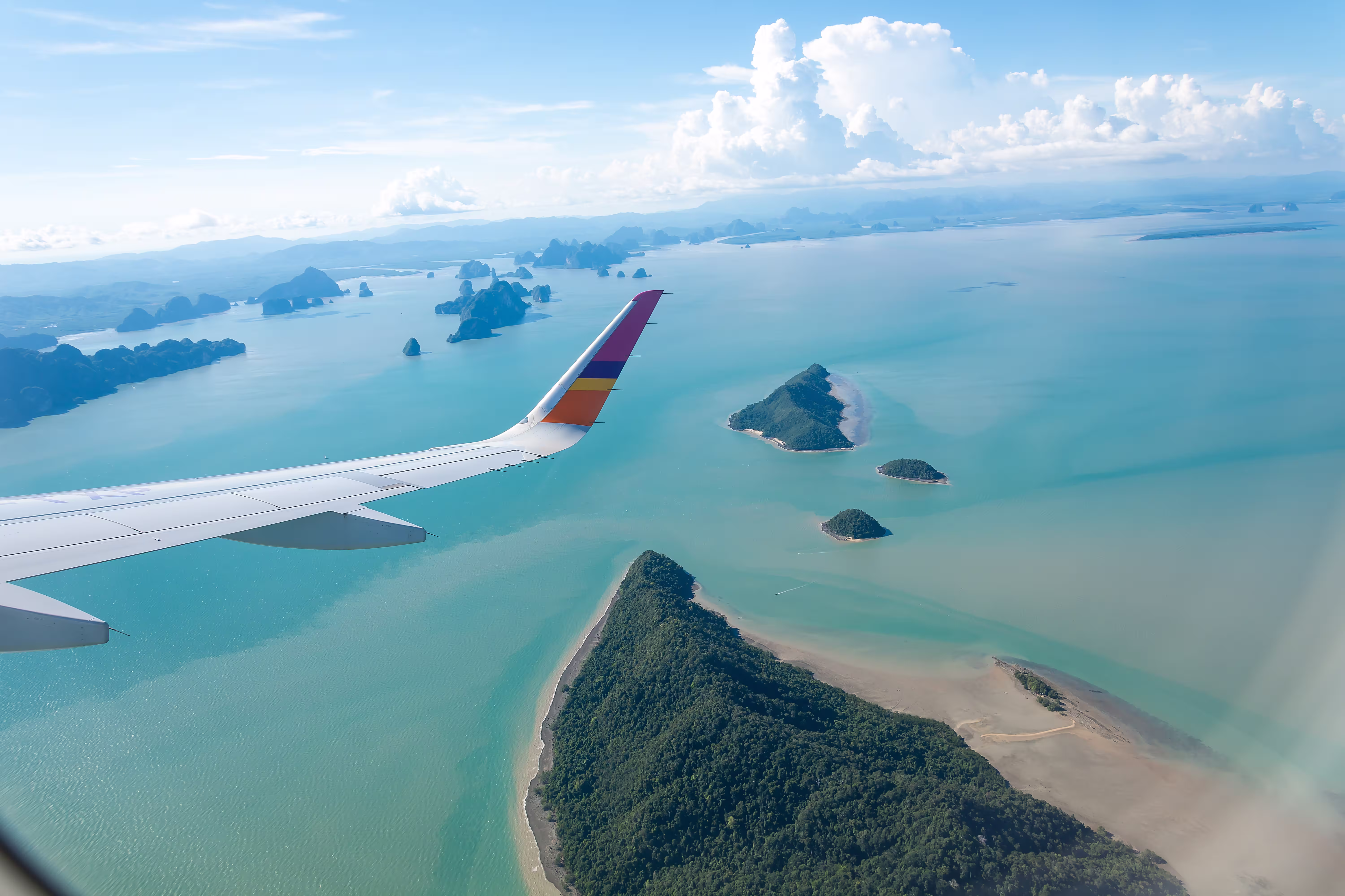 island-sea-with-plane-wing-img