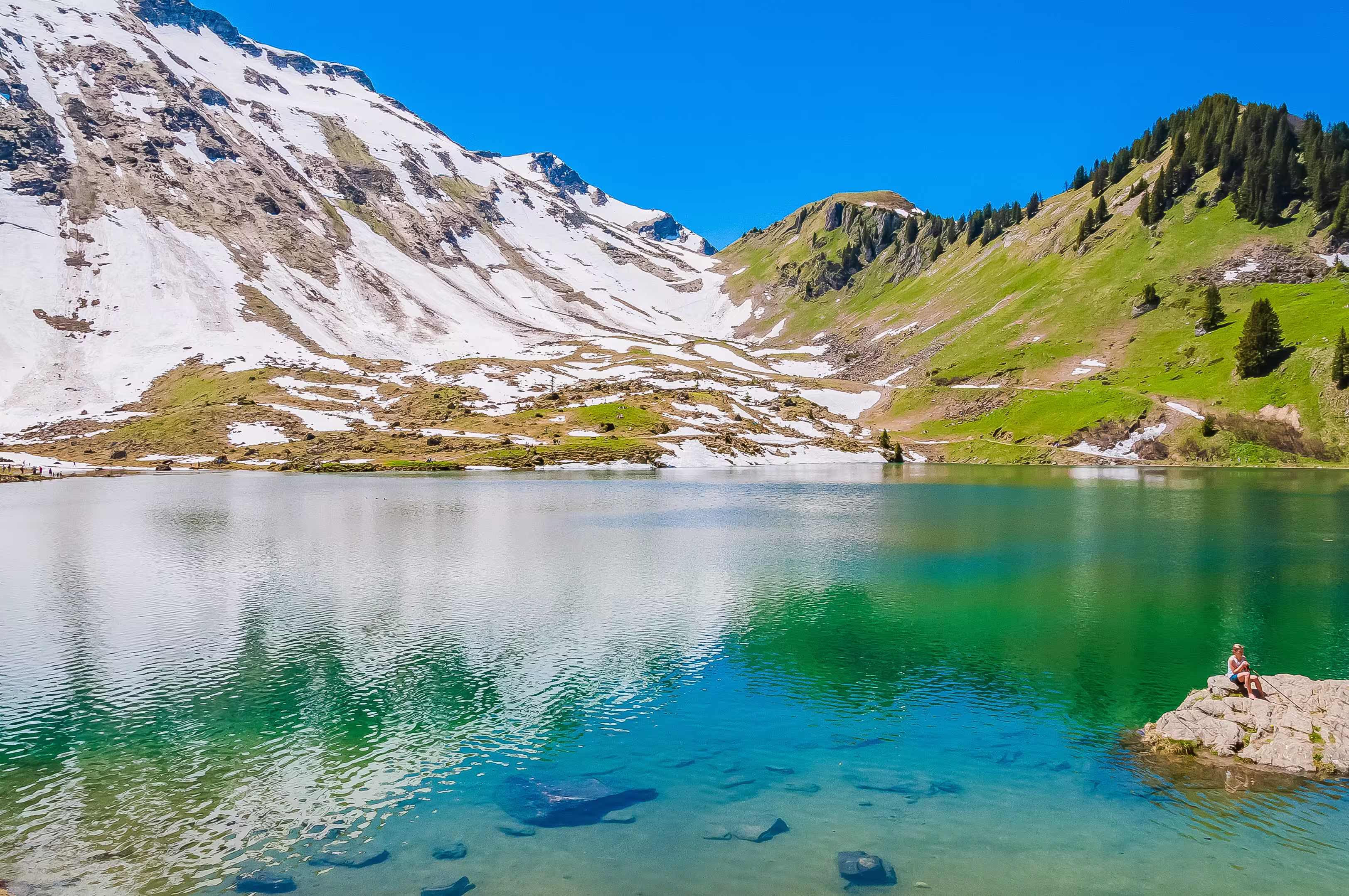Lake Lac Lioson surrounded by Swiss mountains