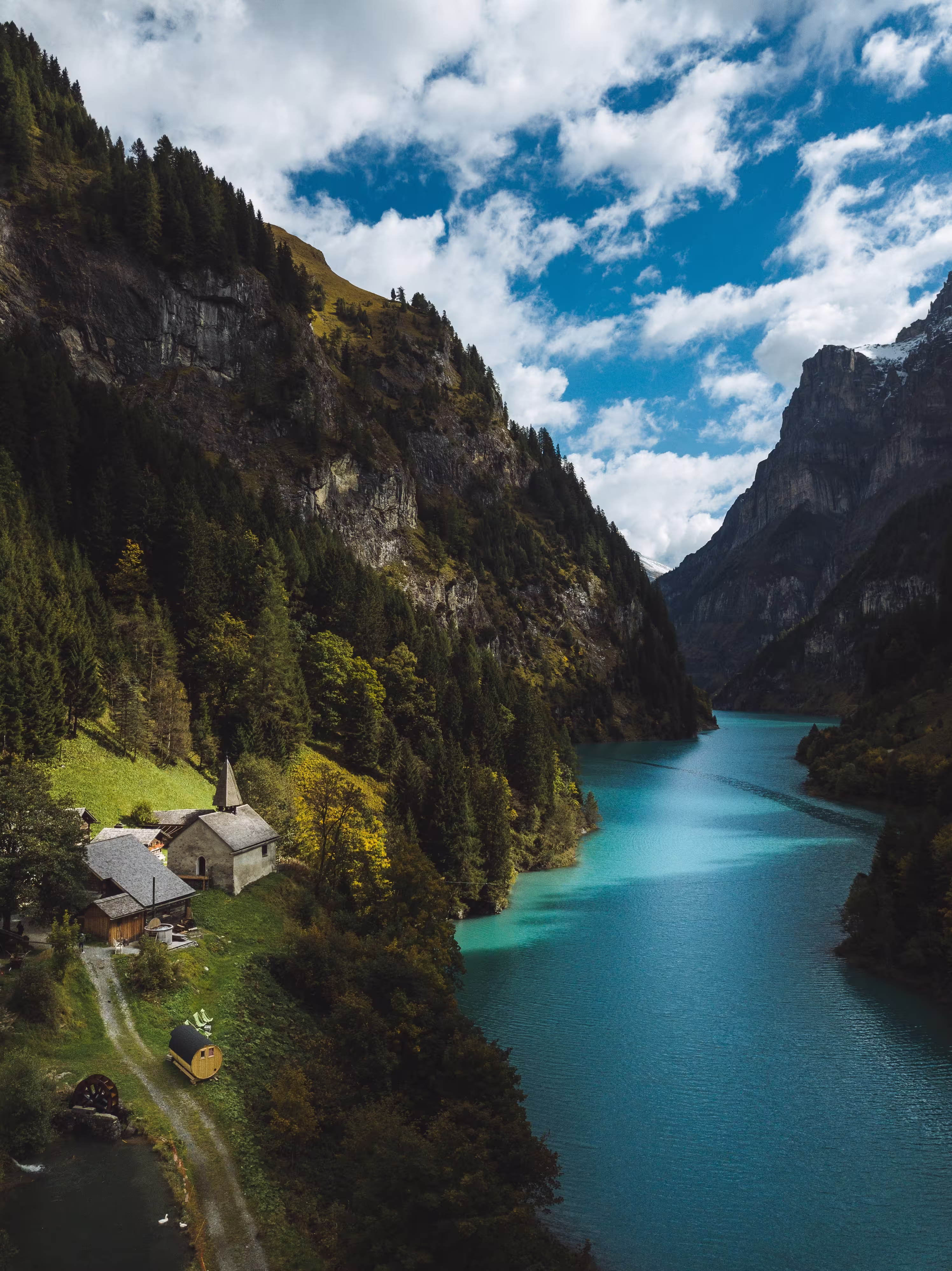 Swiss river mountains and village scenery