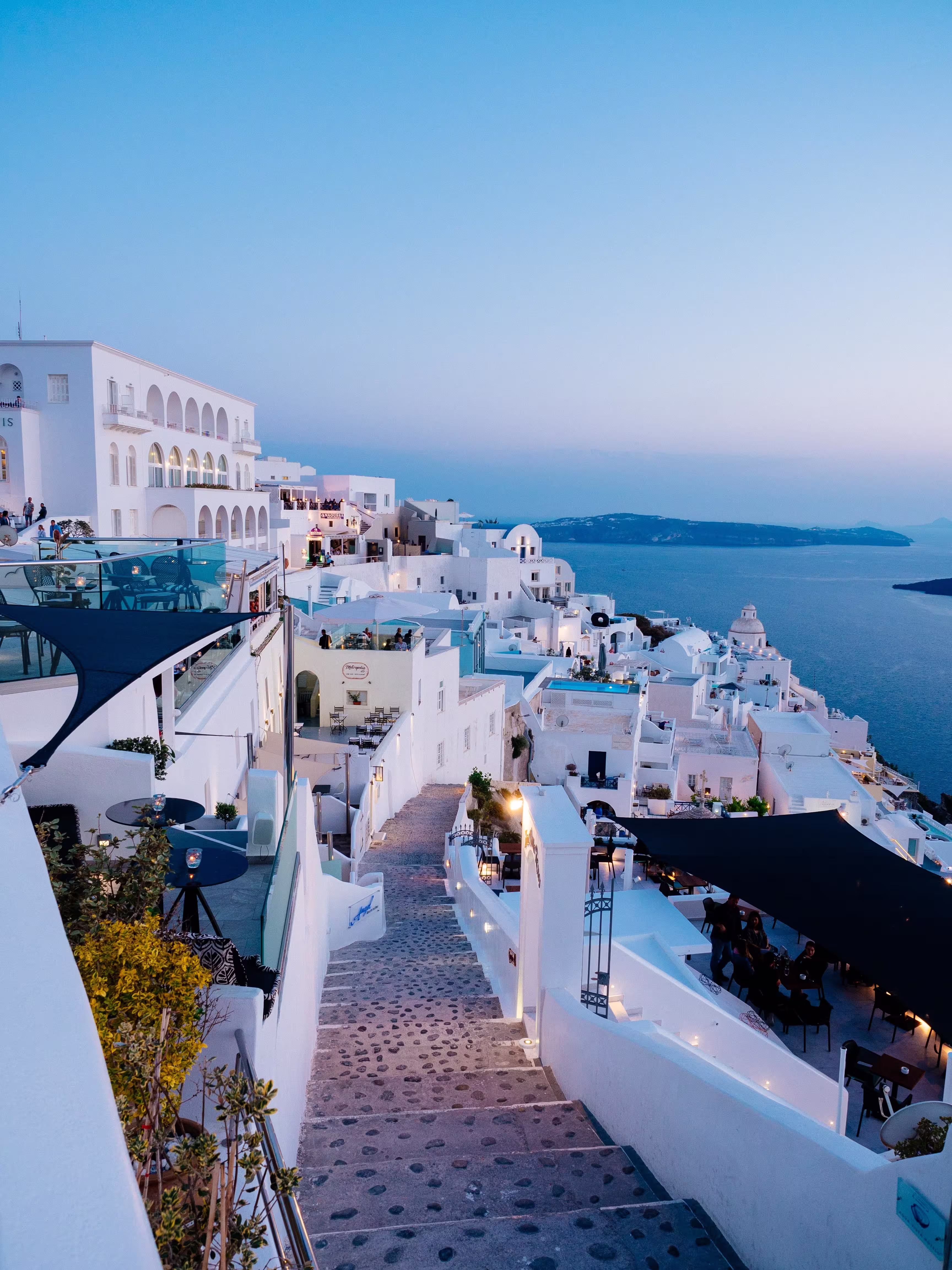 vertical high angle shot white buildings santorini
