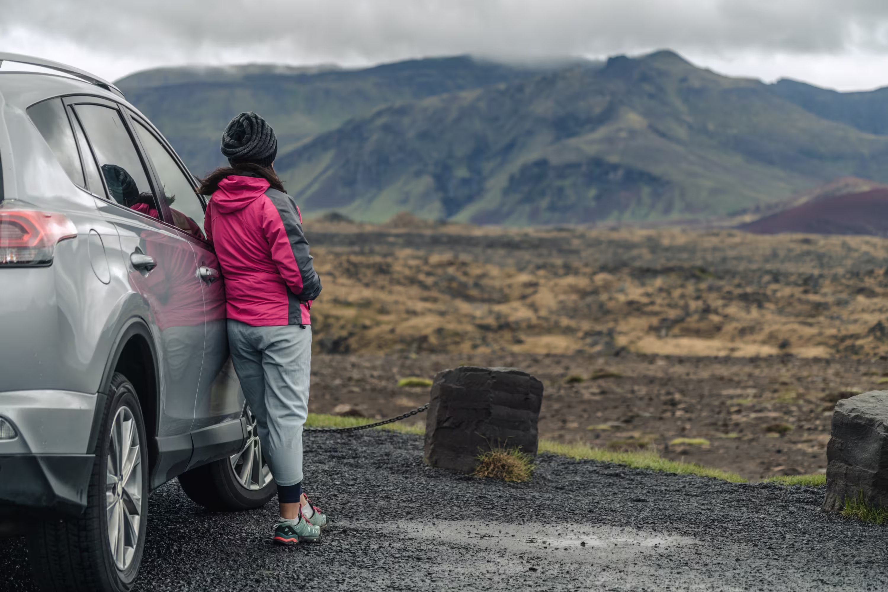 Woman travelling by SUV in Iceland